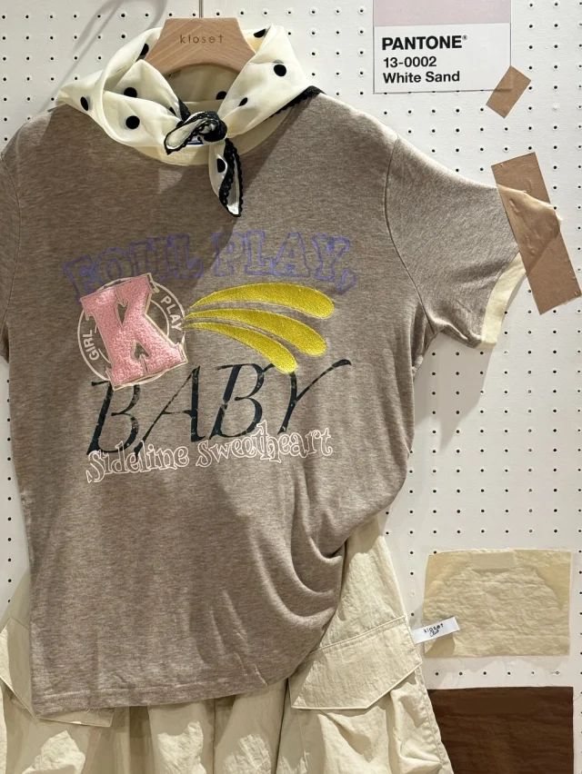 Surrounded by the sound of the game and the glow of golden hour. 
Presenting Sweetheart Ringer Tee complete with screen print, embroidery, and patchwork details you’ll fall for.  #KlosetLS25 #stuckwithyou