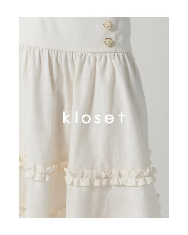 The details make all the difference.
A closer look at the delicate ruffles, textured linen, and signature heart-shaped buttons of the Sunday Strolls Midi Skirt.  #KlosetPF26
#KlosetICantStop